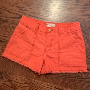 free people orange distressed shorts